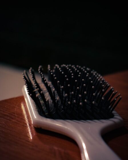 a close up of a hair brush on a table