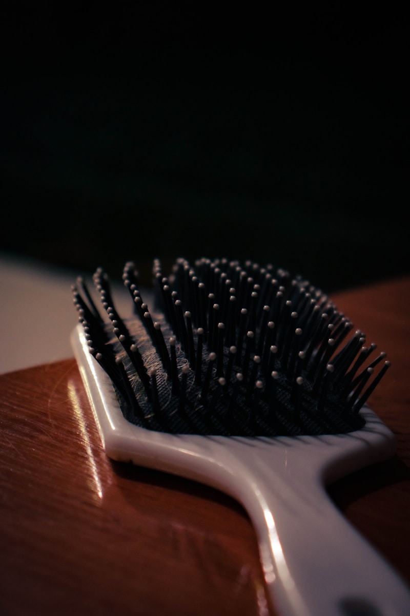 a close up of a hair brush on a table