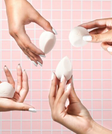 person holding white heart shaped ornament