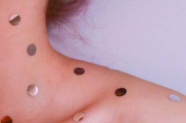 woman with silver stud earrings