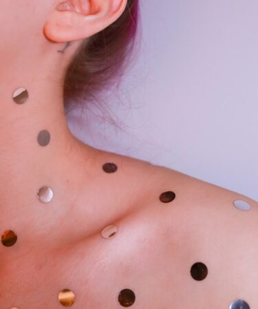 woman with silver stud earrings