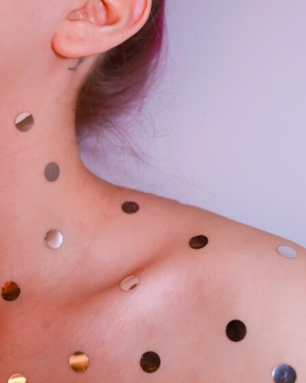 woman with silver stud earrings