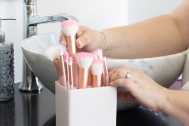 woman holding white and pink box