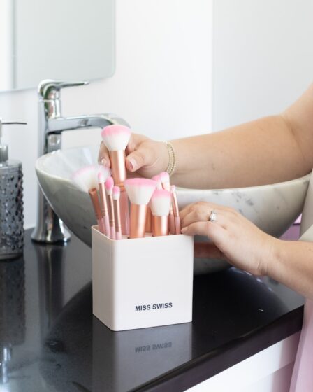 woman holding white and pink box