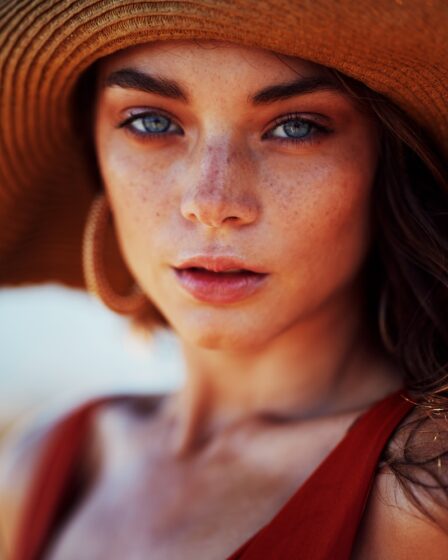 woman wearing sun hat and sleeveless top
