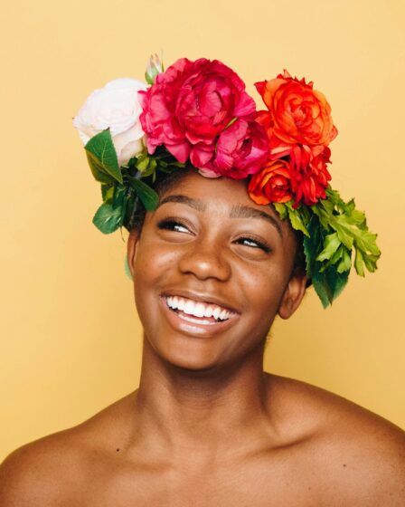 woman smiling wearing flower crown